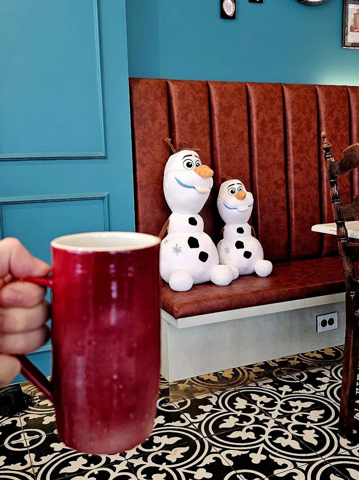 Alex taking shelter from the rain under a bridge while checking the route