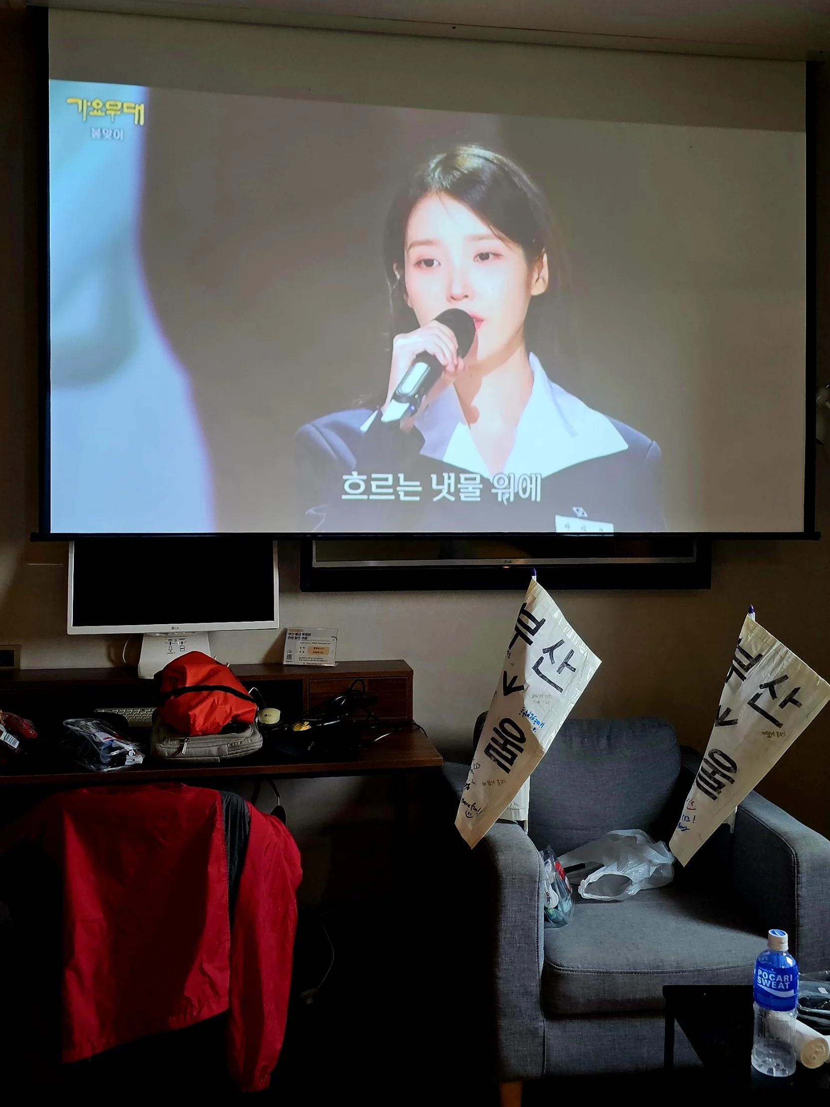Michael and Alex posing with local Korean woman who offered encouragement in the rain
