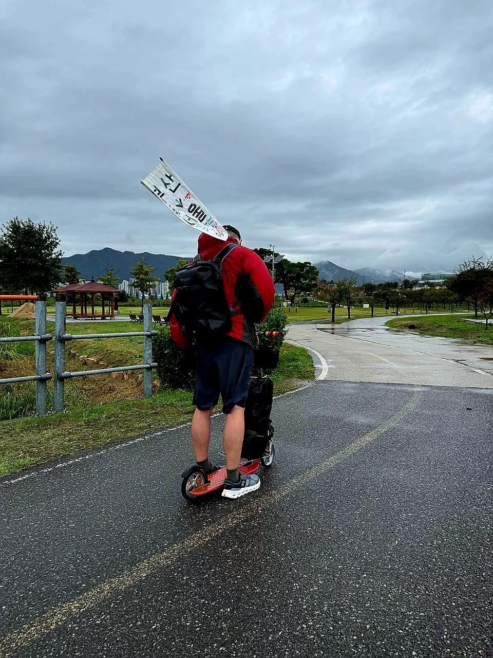 Local Korean woman who offered encouragement and shared stories during the rain