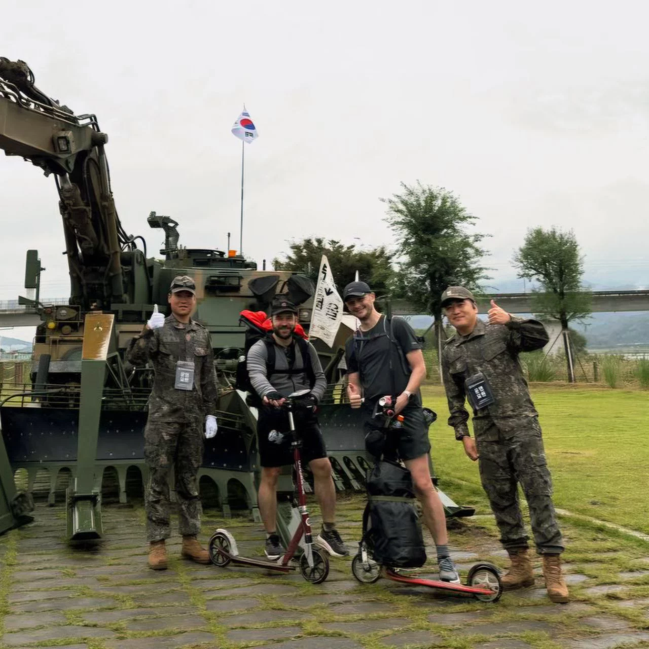 Children playing around tanks at the peace memorial